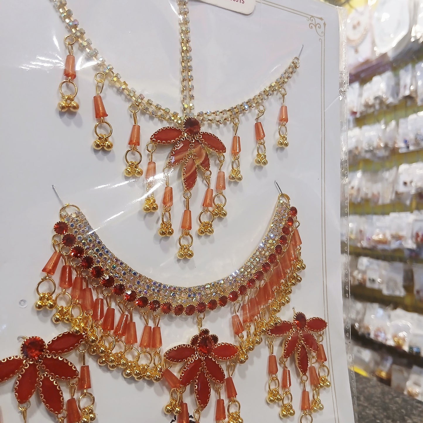 Elegant Golden Pearl Necklace Set with Bindiya– Red & White Pearls with Matching Earrings