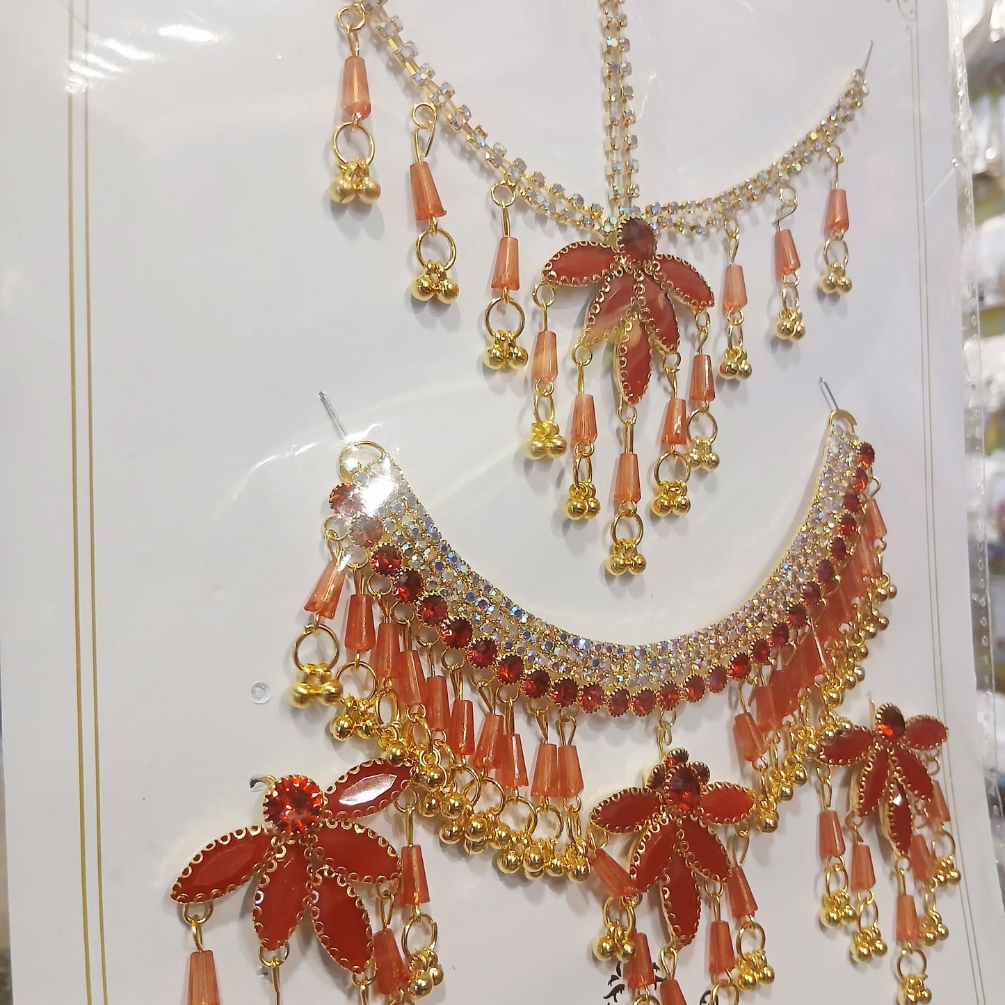 Elegant Golden Pearl Necklace Set with Bindiya– Red & White Pearls with Matching Earrings