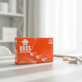 Box of BOSS soft erasers on a desk with office supplies in the background