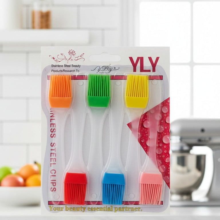 Set of colorful pastry brushes in a clear packaging with 'YLY' branding on a kitchen counter.