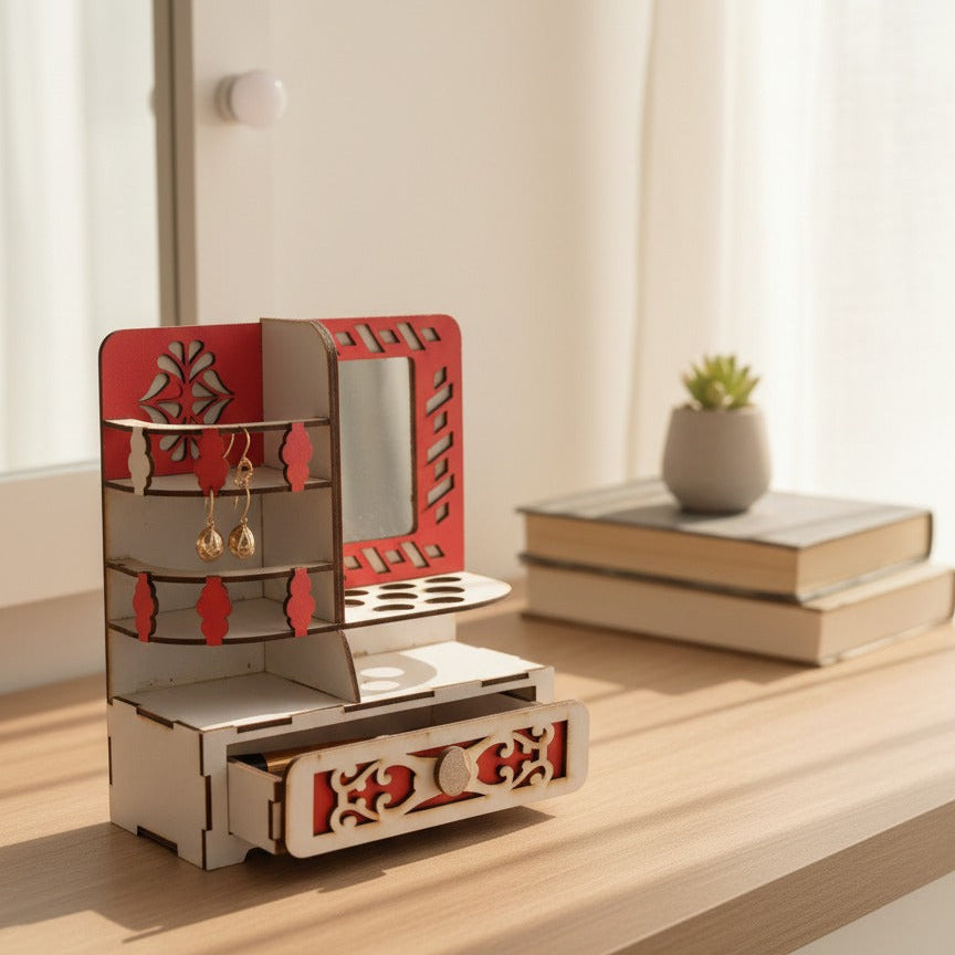 Wooden jewelry organizer with mirror on a wooden surface with books and a plant in the background.